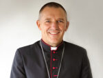 Bishop Michael Gielen halts parish mergers