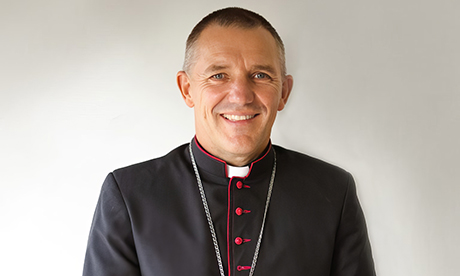 Bishop Michael Gielen halts parish mergers